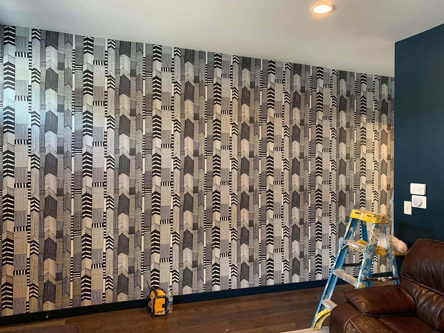 Professional wallpaper installation in progress